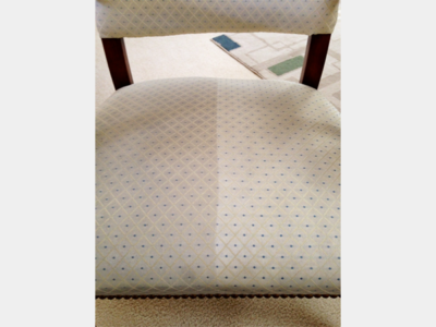 After cleaning image showing a dining chair seat that is half clean (left side) and half dirty (right side) to demonstrate the upholstery cleaning result.